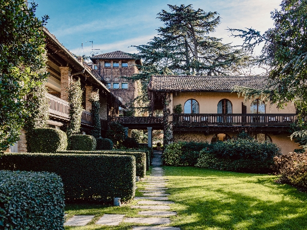 An old building surrounded by lovely gardens