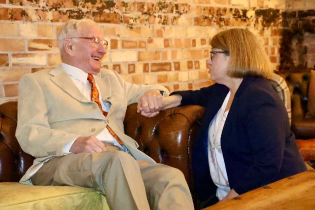 Carer supporting older gentleman at  wedding