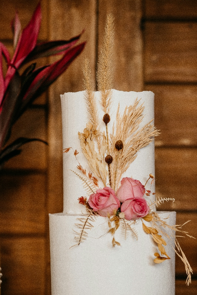 pampas grass decorating a wedding cake