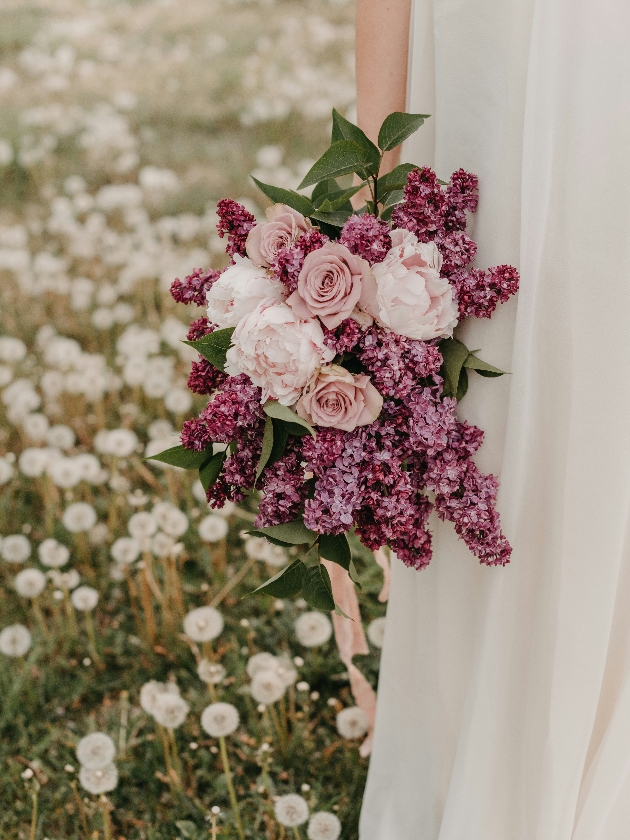 bridal bouquet with roses peonies and lilaces