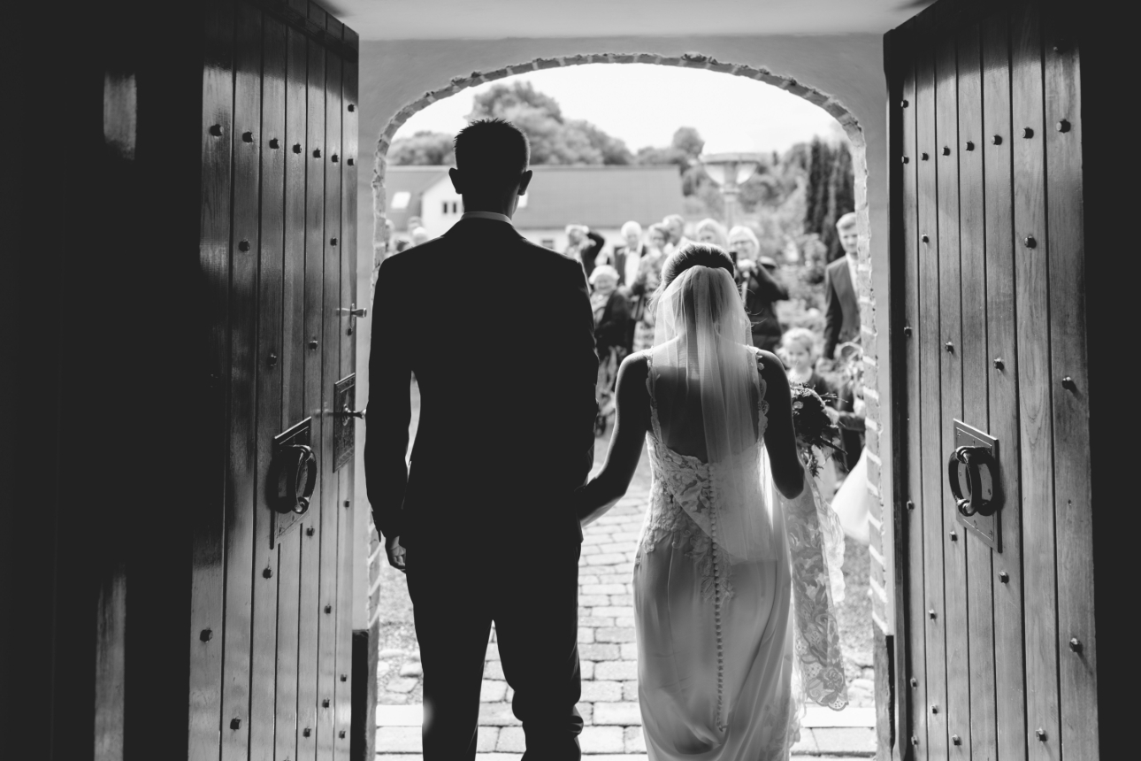 couple on wedding day leaving church