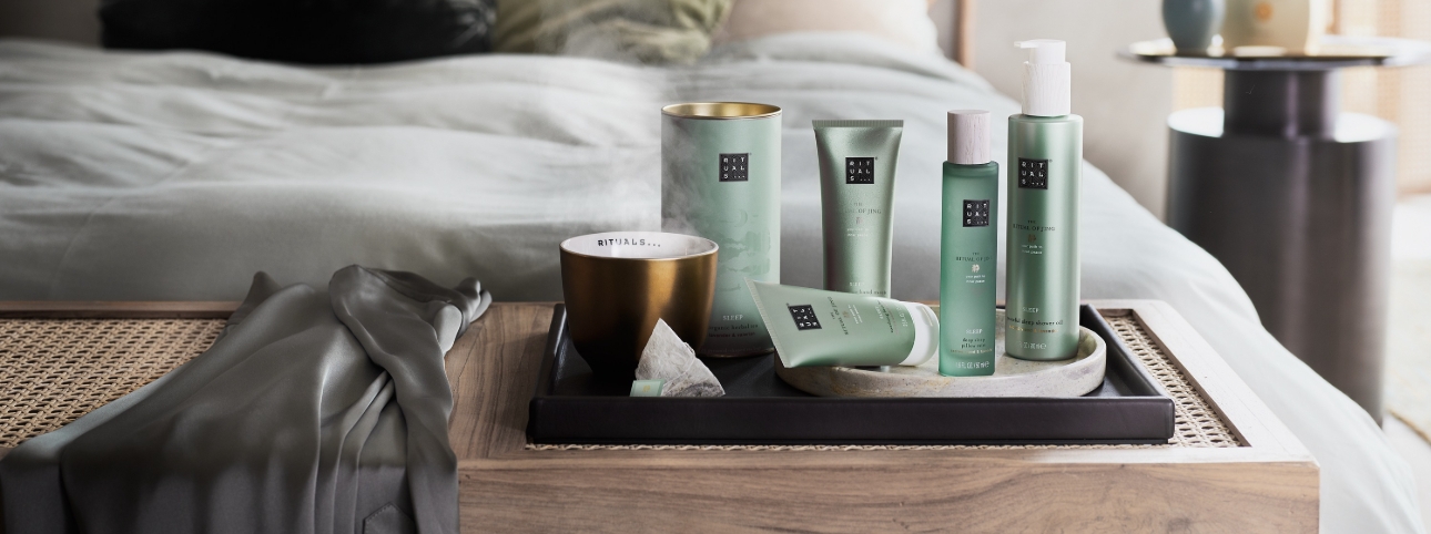range of Rituals products at the end of a bed