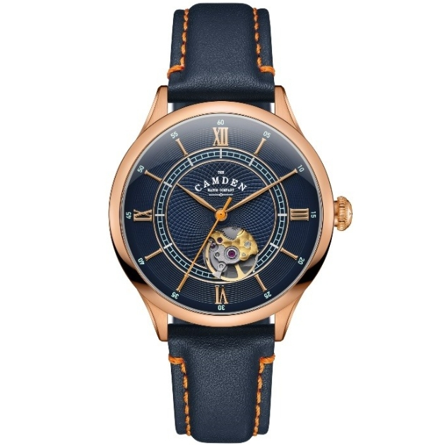 navy blue and rose gold watch with orange stitching