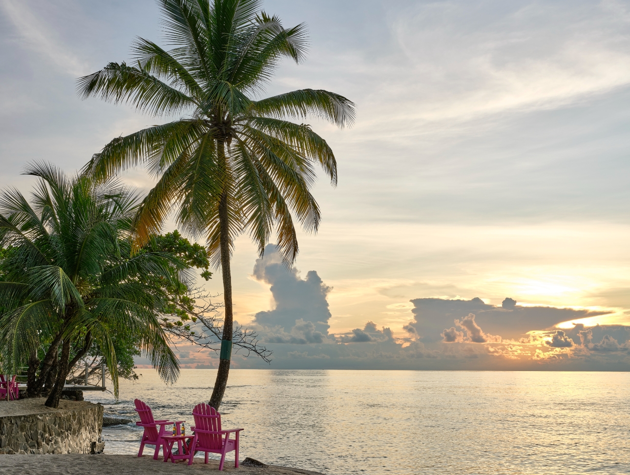 two deck chairs on a beach