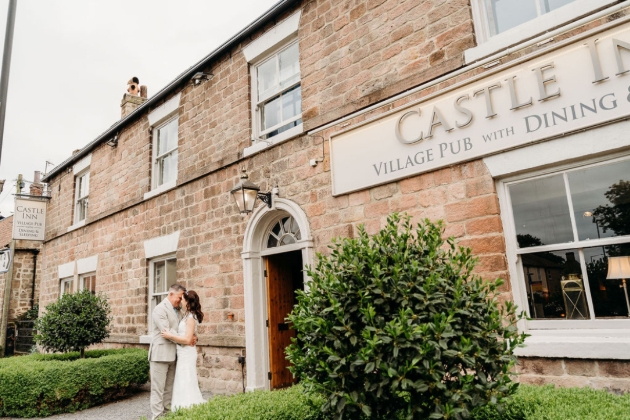 Bride and groom outside The Castle in Spofforth 