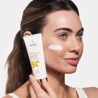 lady with suncream on face